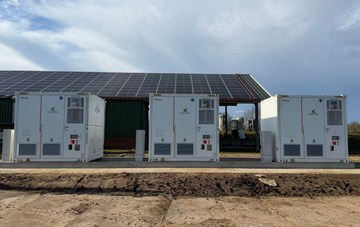 Three SolaX Trene XL P500B1044 commercial battery storage cabinets integrated with a rooftop solar PV system
